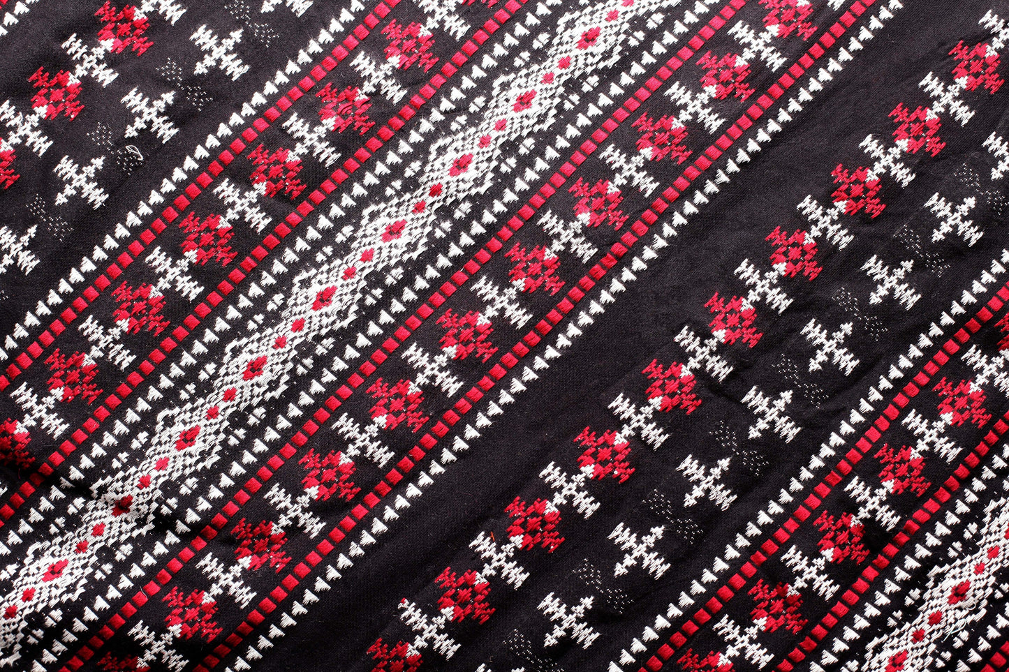 Red, Black and White Woven Fabric with Aztec Patterns