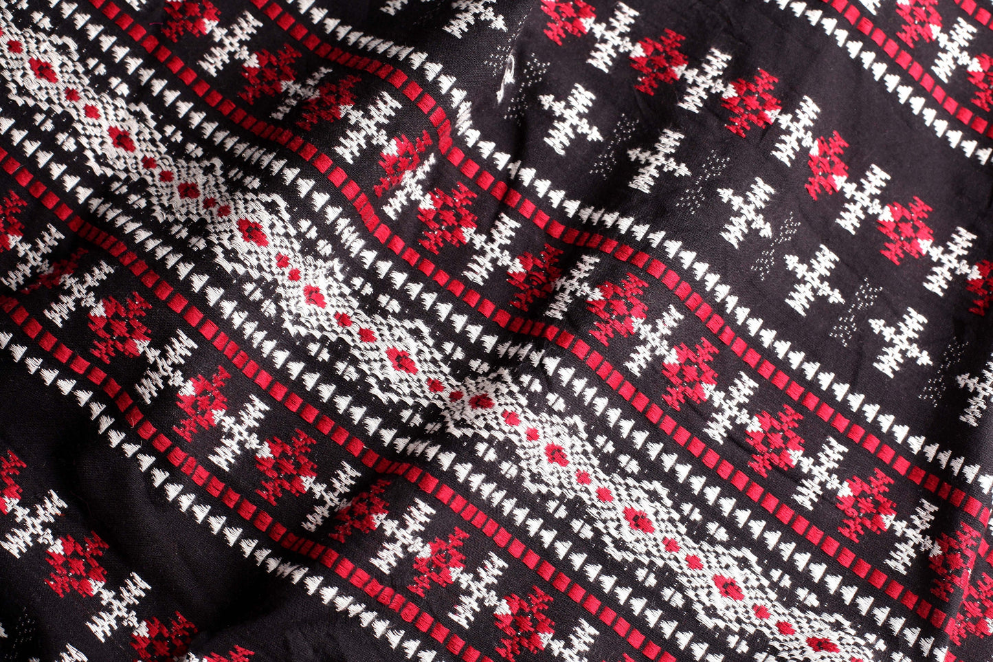 Red, Black and White Woven Fabric with Aztec Patterns
